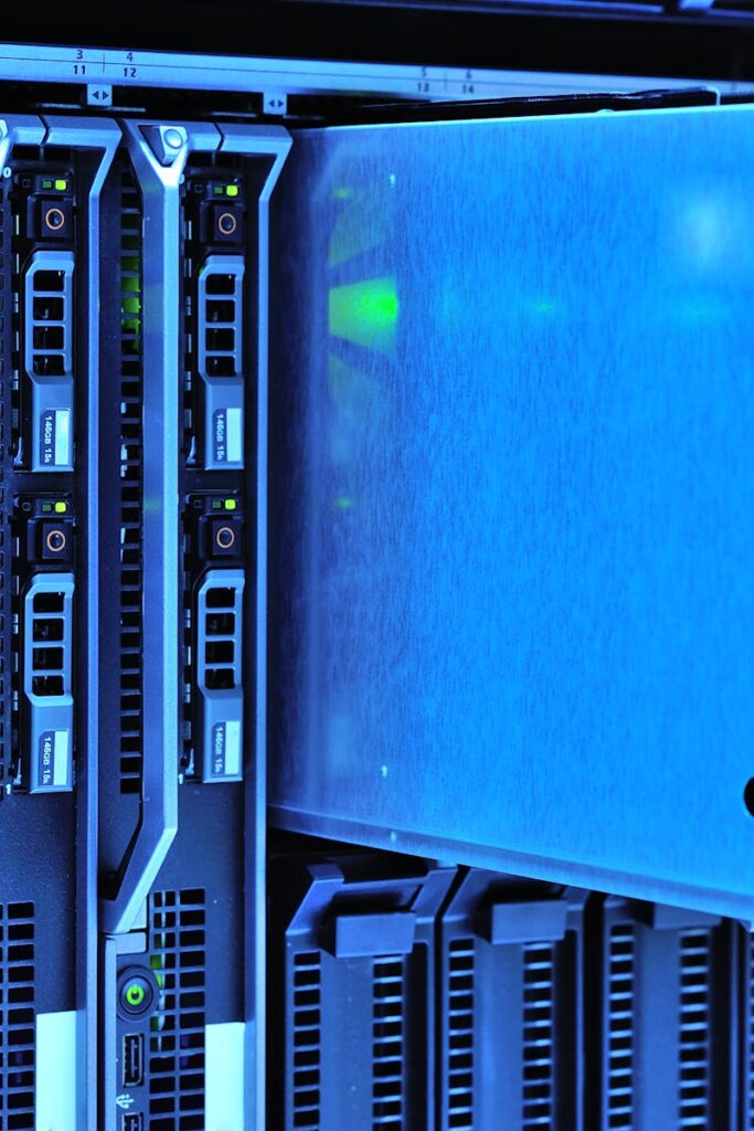 Detailed view of server racks with glowing lights in a data center environment.